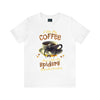 a white t - shirt with a cup of coffee on it
